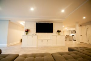 custom basement remodel auburn landing custom builder living room tv couch